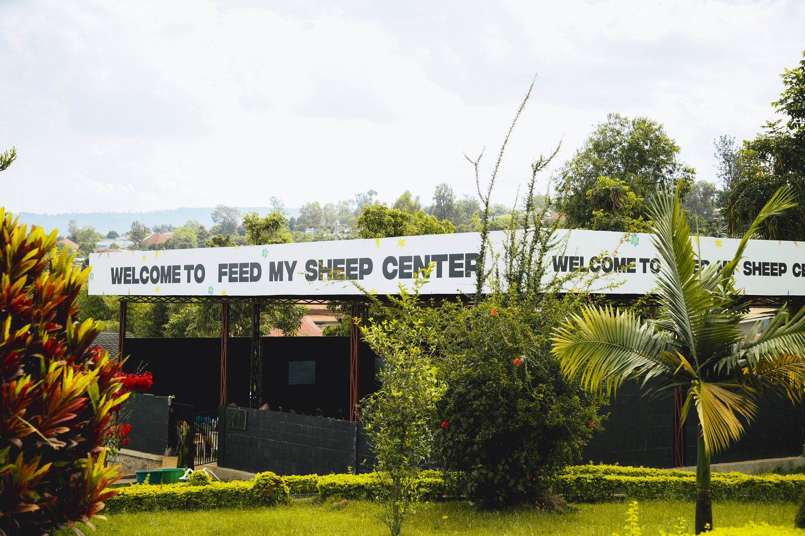 The entrance of the Feed My Sheep Center with its welcome sign